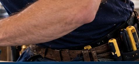 Technician's tool belt with a hammer and tape measure
